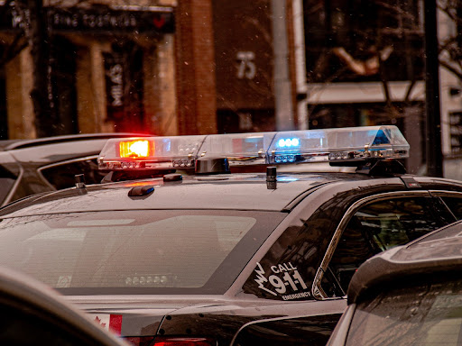 top of the police car  sirens on lit up