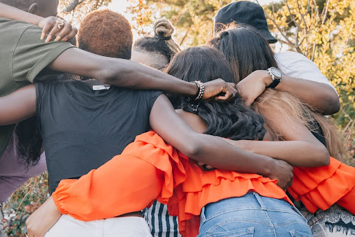friends hugging in group
