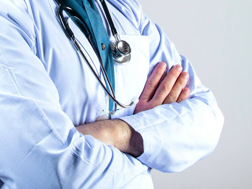 doctor folding arms
