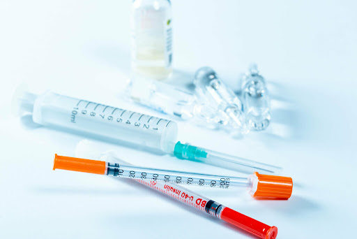 needles and syringes laying askew