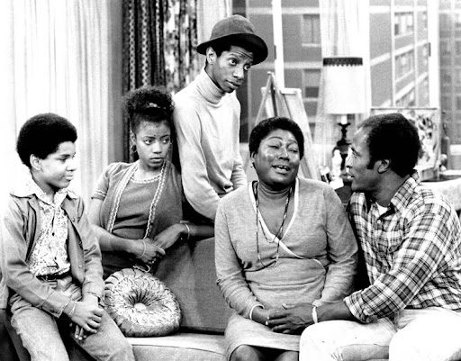black and white photo of the evans family from the sitcom good times