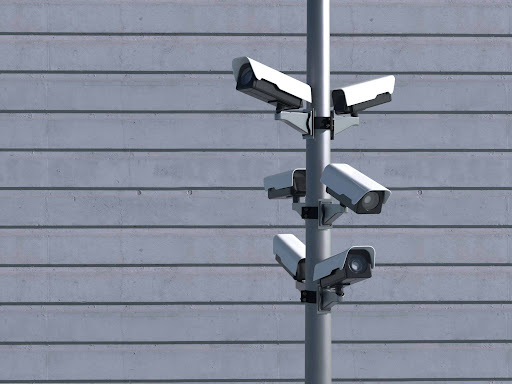 cameras on a pole watching