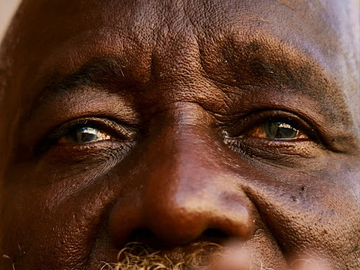 close up of a black man with a beard 