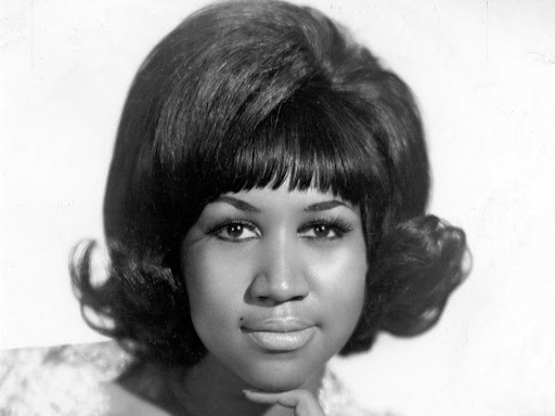 black and white photo of aretha franklin staring straight ahead 