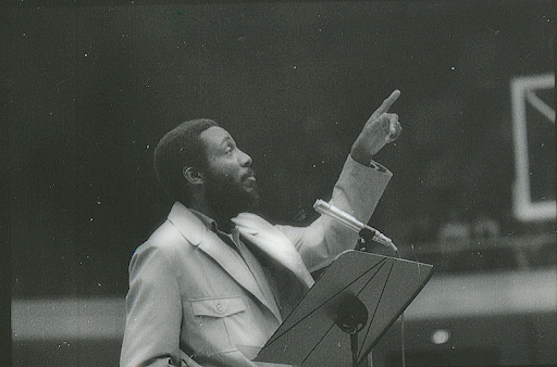 man pointing out to the audience
