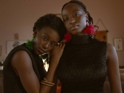 a couple of women standing next to each other