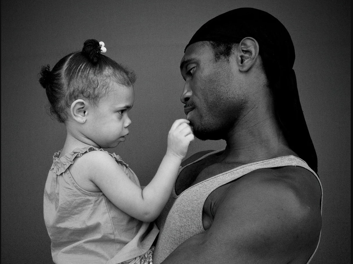 Father holding daughter
