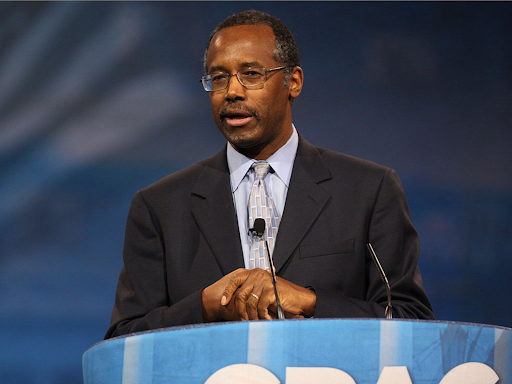 ben carson in speaking in front of a podium