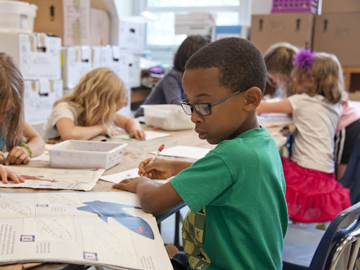 children sitting down in school