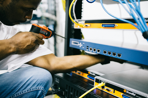 black technician working with hardware