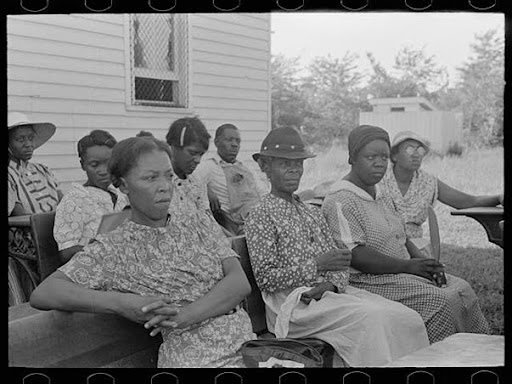 group of black women sitting together