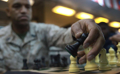 black man playing chess