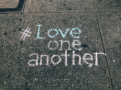love one another written in chalk