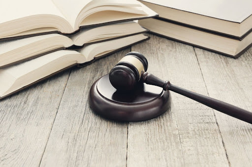 gavel resting in front of books on a table