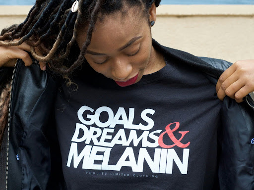 shirt that says goals, dreams & melanin