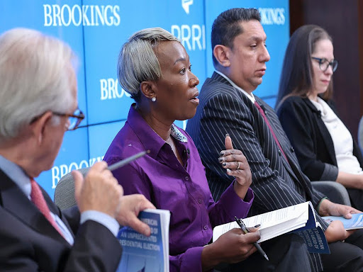 joy reid standing amongst people speaking