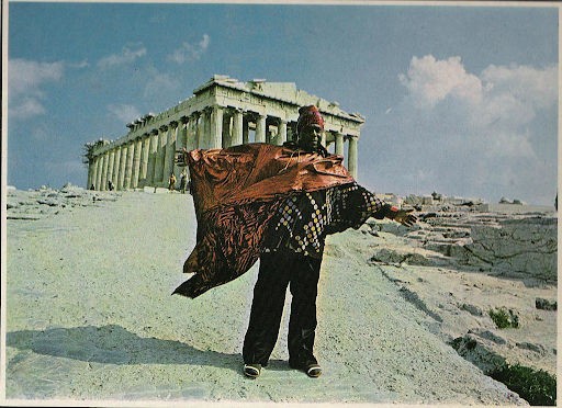 man standing in front of ancient ruins