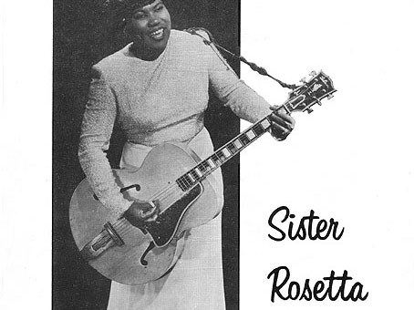 sister rosetta playing a guitar