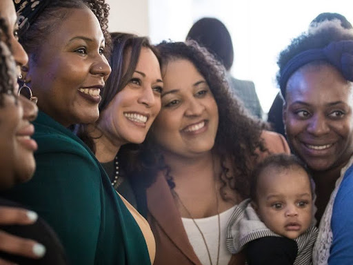 kamala harris surrounded by other women 