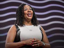 black woman speaking at a podium