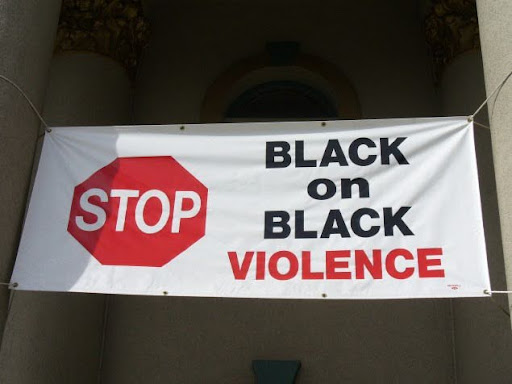 banner that says black on black violence