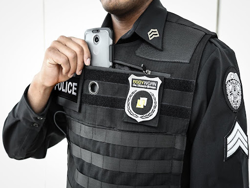 law enforcement officer with badge on chest