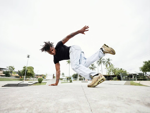 person breakdancing on concrete