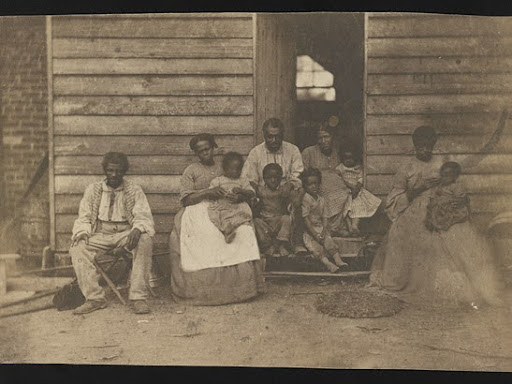 group of enslaved people sitting down