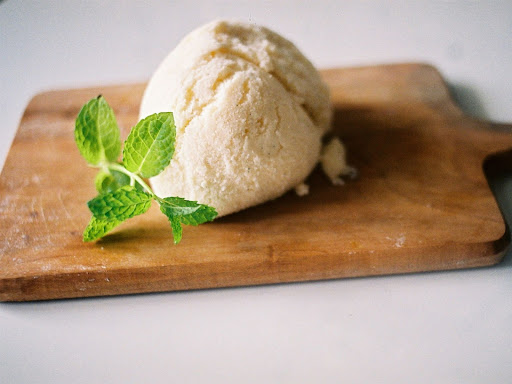ice cream on a wooden cutting board