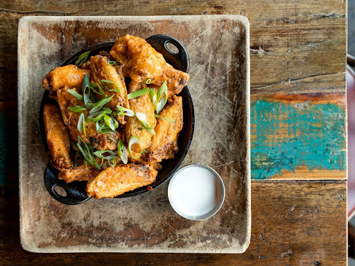 a plate of wings on a table