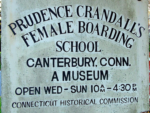 sign that says prudence crandall's female boarding school in canterbury connecticut