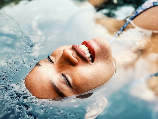 person laying face up in water