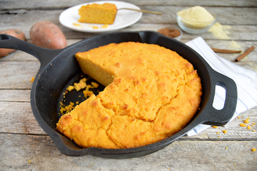 cast iron skillet with cornbread in it