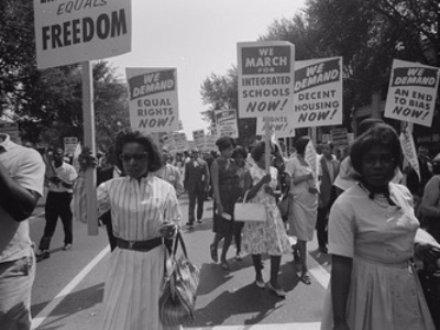 protestors holding signs