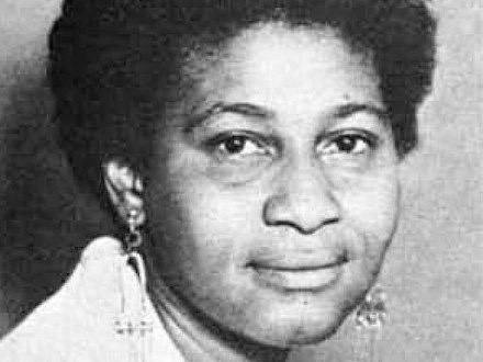 charlene mitchell smiling in a black and white photo