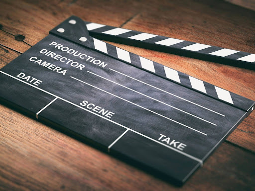movie clapper on wooden background 