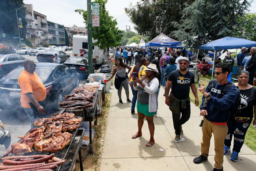 people gathered outside at a bbq