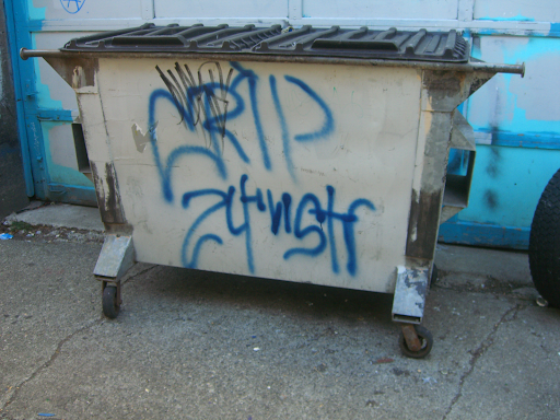 grafitti on a dumpster