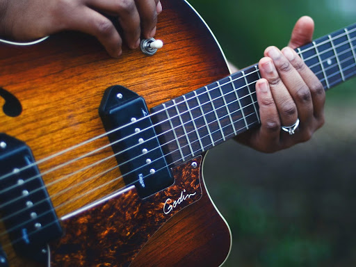 musician holding a guitar