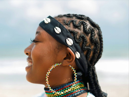 black woman with cowrie shell headdress