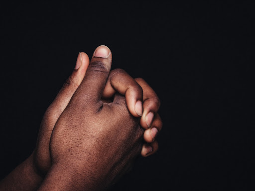 hands folded together clasped