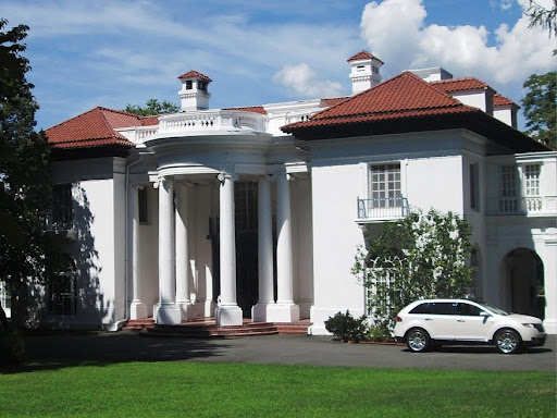 front of a mansion