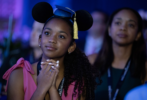 young black person with mouse ears on head staring forward