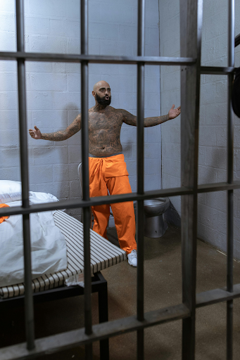 a man in solitary confinement inside a prison cell