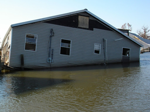 photo of a house in st bernard parish in louisiana sunken in water during hurricane katrina
