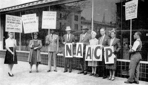 people standing together protesting