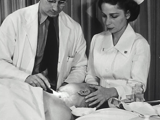 doctor and nurse examining a patient