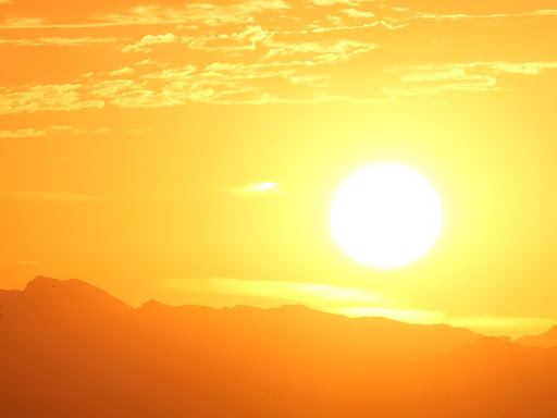 sun rising over mountains