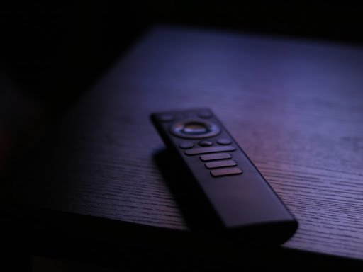 remote on a table in the dark