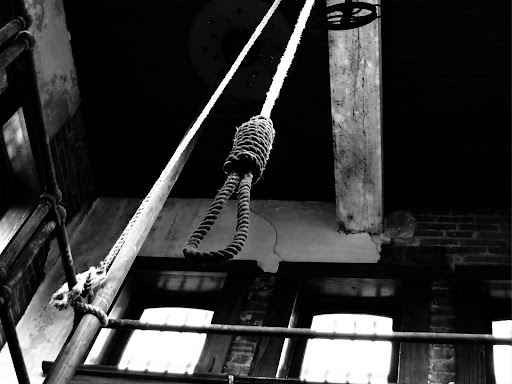 noose hanging from ceiling beam